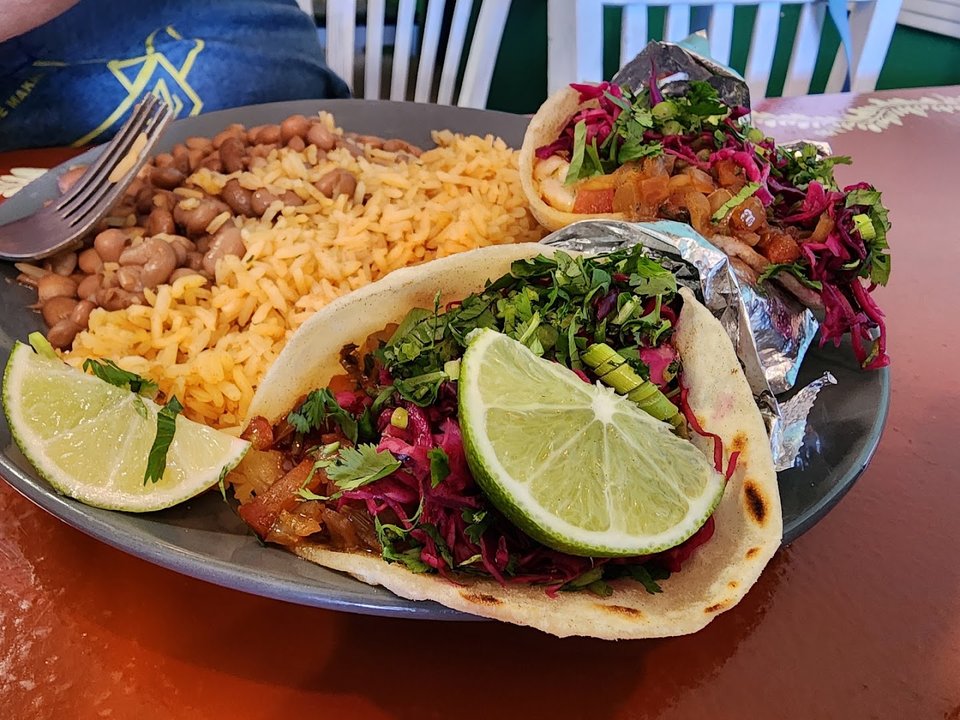 Colorful tacos served in a relaxed dining room.