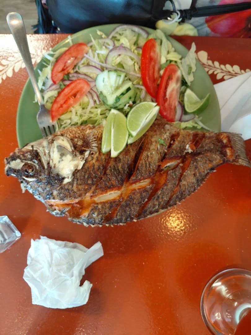 Mexican plates with rice and fresh garnish.